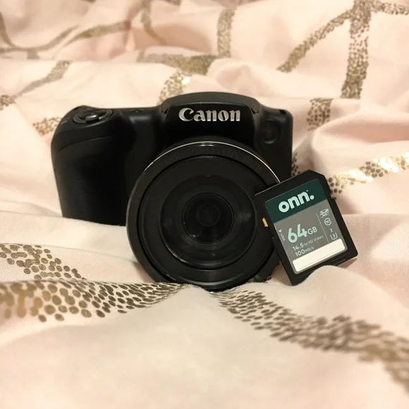 Canon SX420 camera- tripod- 64GB storage- Camera battery charger